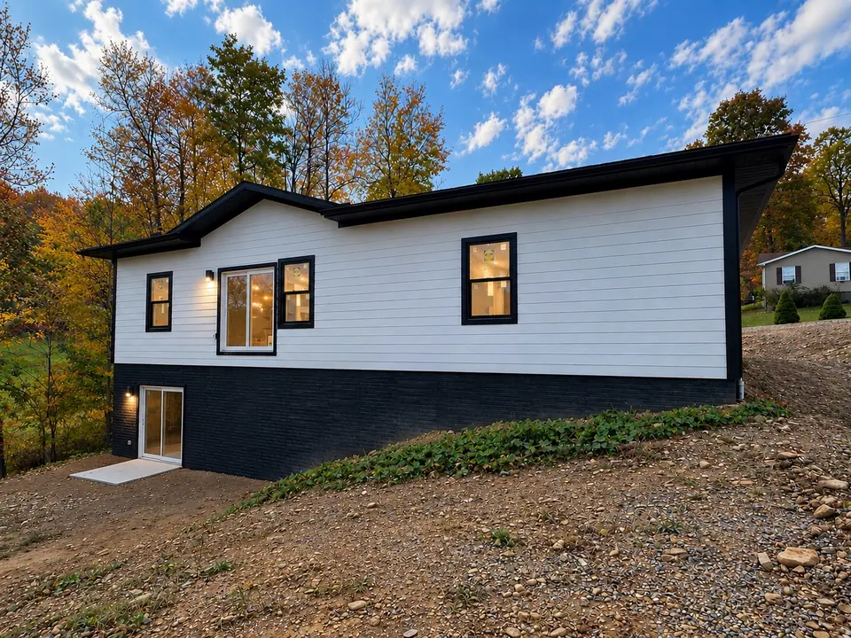 Side of 202 King Drive showing the walk-out basement level
