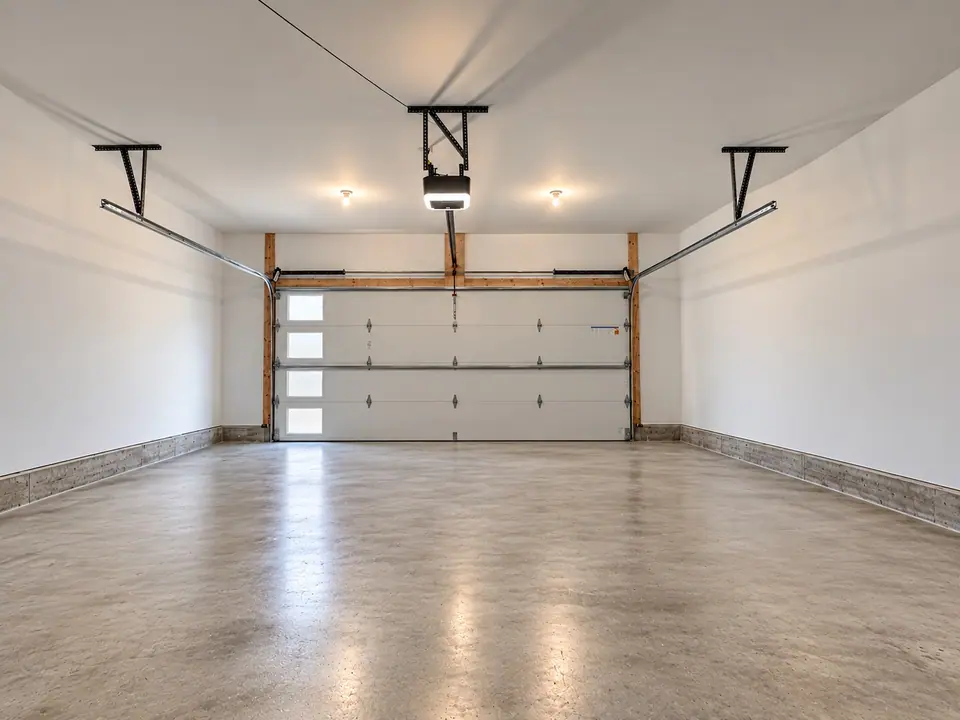 Garage interior looking toward the garage door, with concrete floor